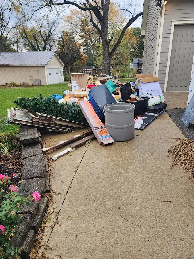 Dumpster being loaded with debris for 3 Yard Dumpster Rental in North Alamo